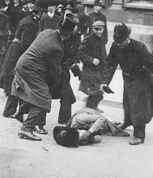 British-suffragette-being-beaten-Black-Friday-1910